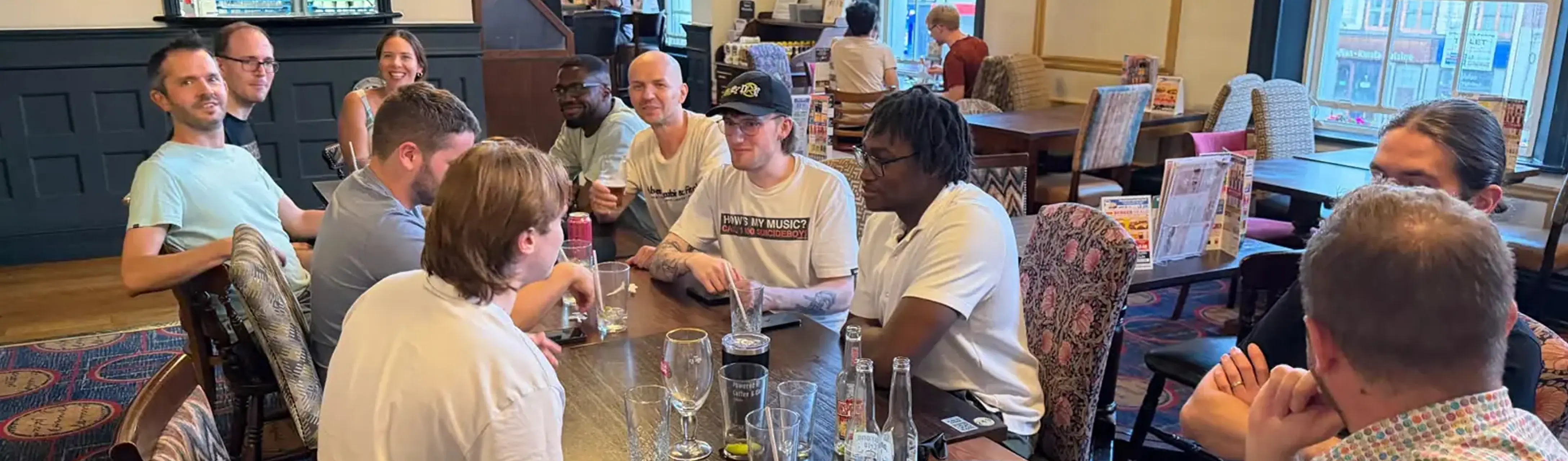 People chatting at the bar during a Tech Meet evening