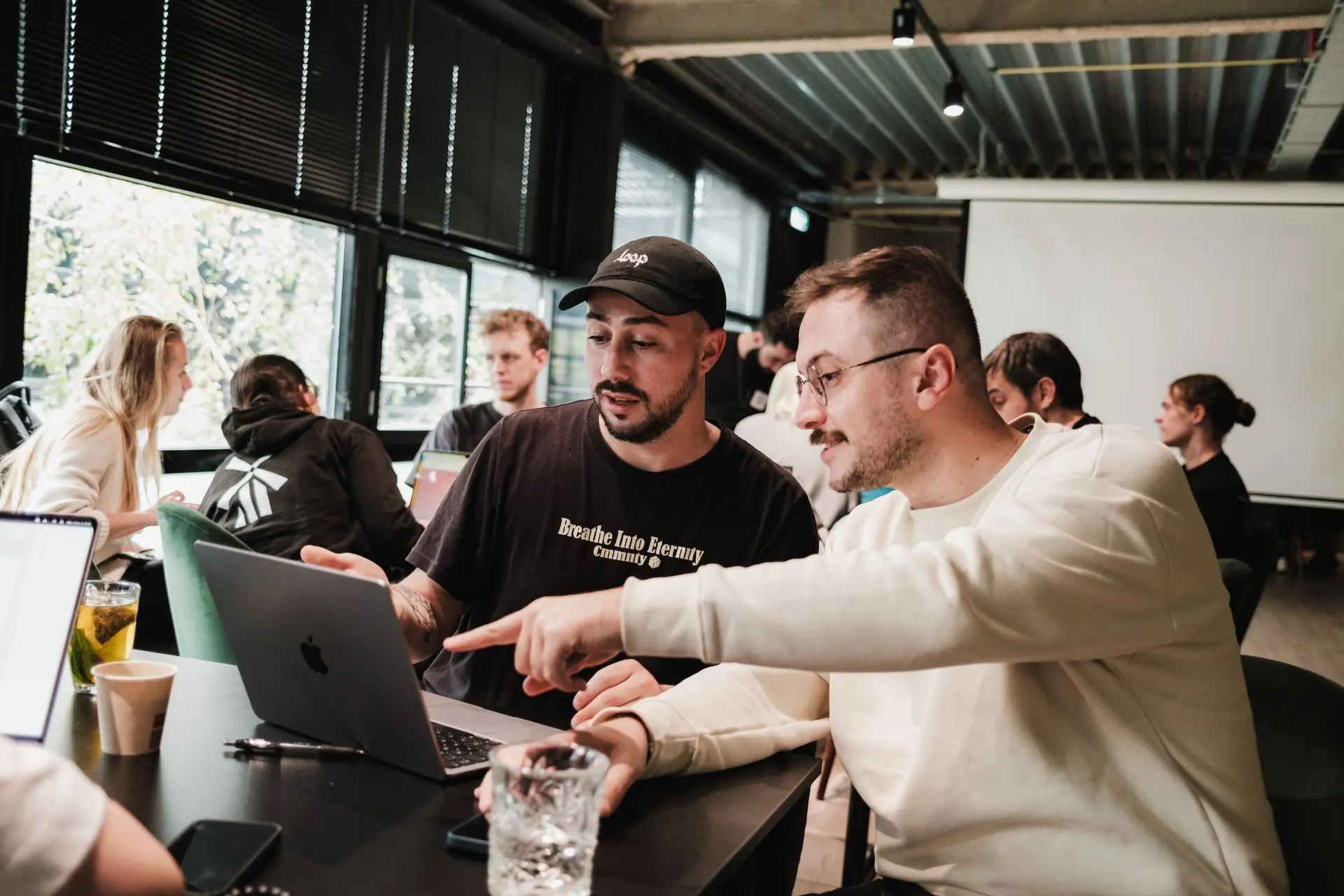 Two people looking at a laptop together