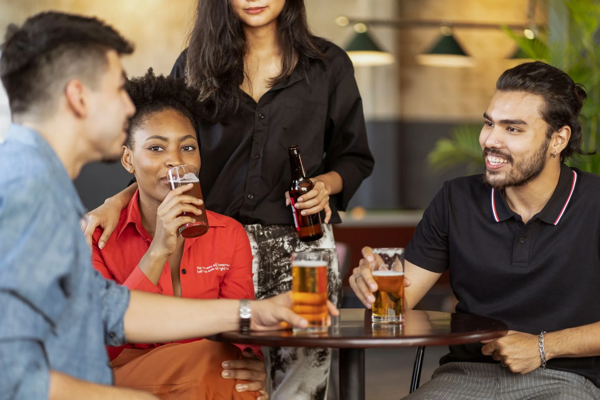 People chatting over drinks at a Tech Meet evening
