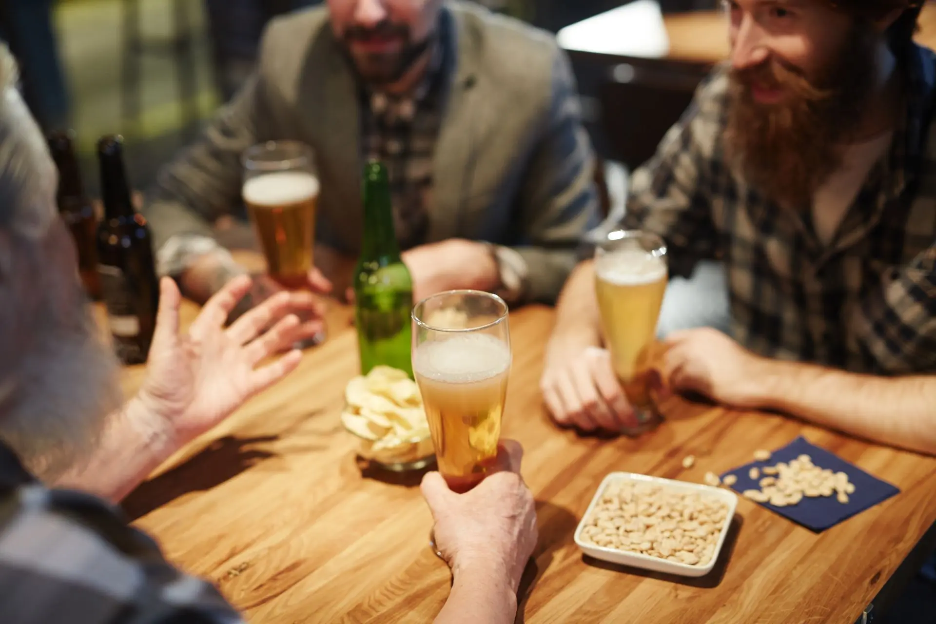 A group sharing drinks around a table