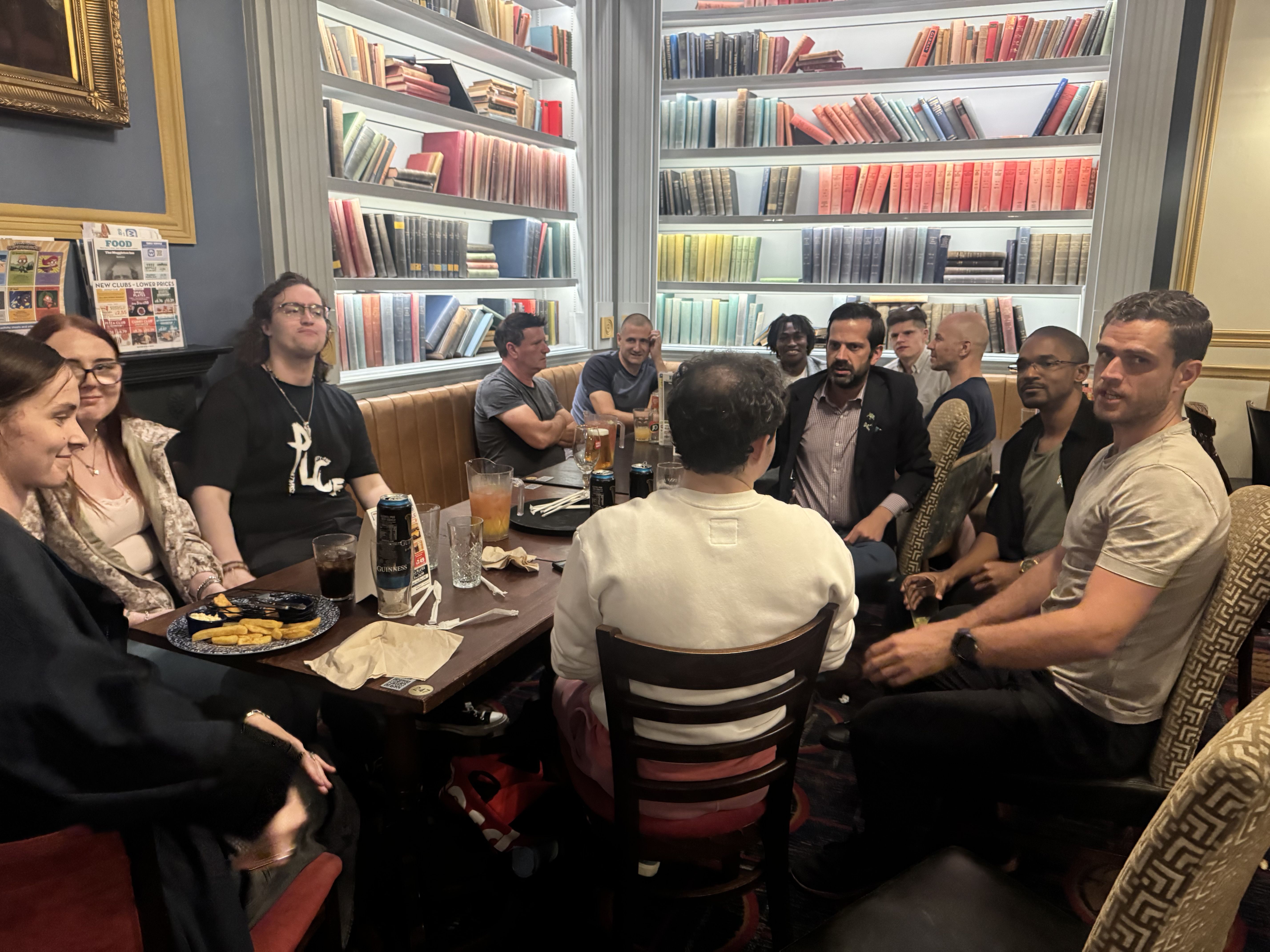 People chatting over drinks at a Tech Meet evening