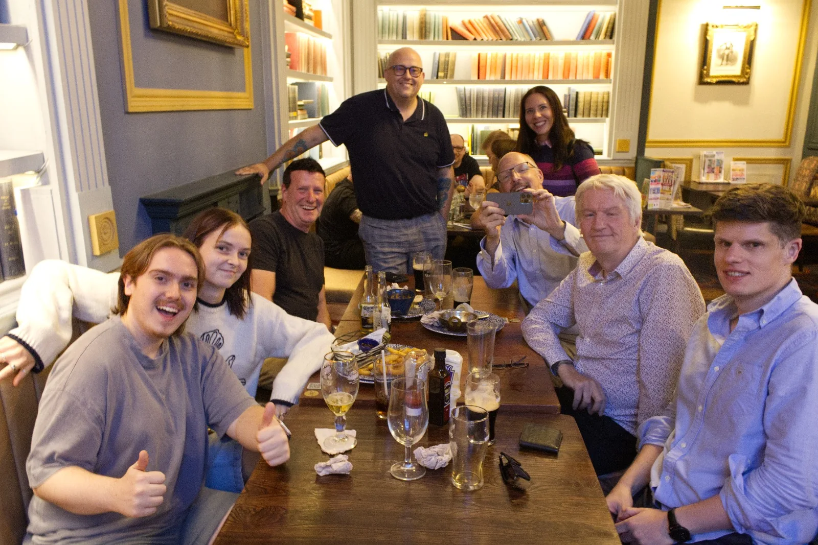 A group sharing drinks around a table